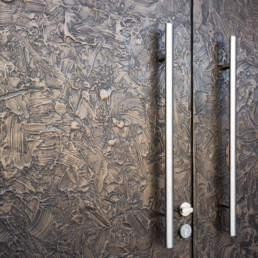Metalier liquid metal textured Smoky Bronze on the door of a private residence