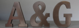 bronze sign, metal veneer, liquid metal, smoky bronze