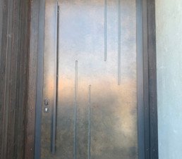 smoky bronze, statement entrance door, liquid metal, metal veneer