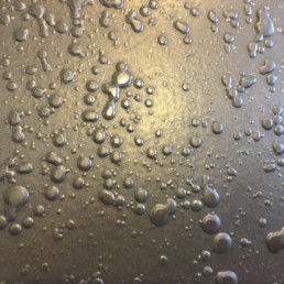 Metalier liquid metal bronze with black Wax sputter