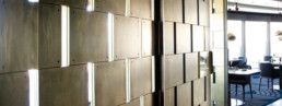 The Sugar Club; brass liquid metal walls on the outside of the private dining room
