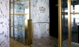 The Sugar Club, Brass entrance doors in Metalier liquid metal
