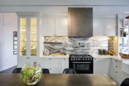 Smoky bronze rangehood: Kitchens by Design: Metalier liquid metal