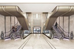 Escalators in Harrods of London; Metalier liquid metal; champagne gold