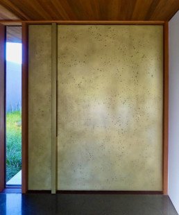 Brass moonrock; statement front door; entrance way; brass liquid metal; brass metal veneer