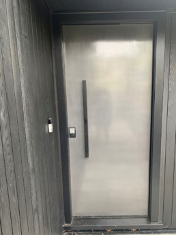 Statement entrance door; gunmetal door; gunmetal liquid metal; gunmetal metal veneer; decorative metal coating; gunmetal;