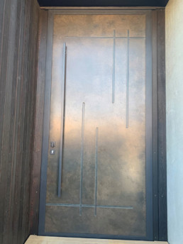 smoky bronze entrance door; smokey bronze; statement metal door