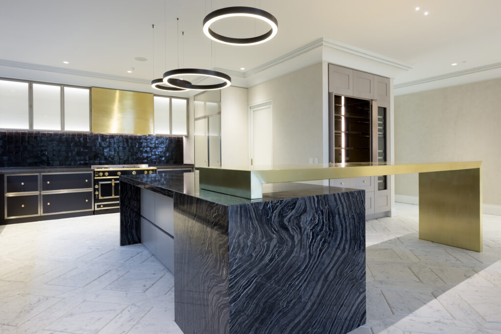 Metalier liquid metal classic gold finish on a custom cantilevered breakfast bar and range hood in a designer kitchen – Philippines.