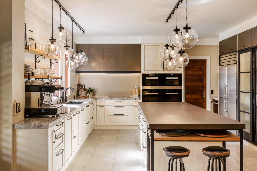 Metalier liquid metal smoky bronze finish on a custom range hood and large kitchen island in a contemporary home – New Zealand.