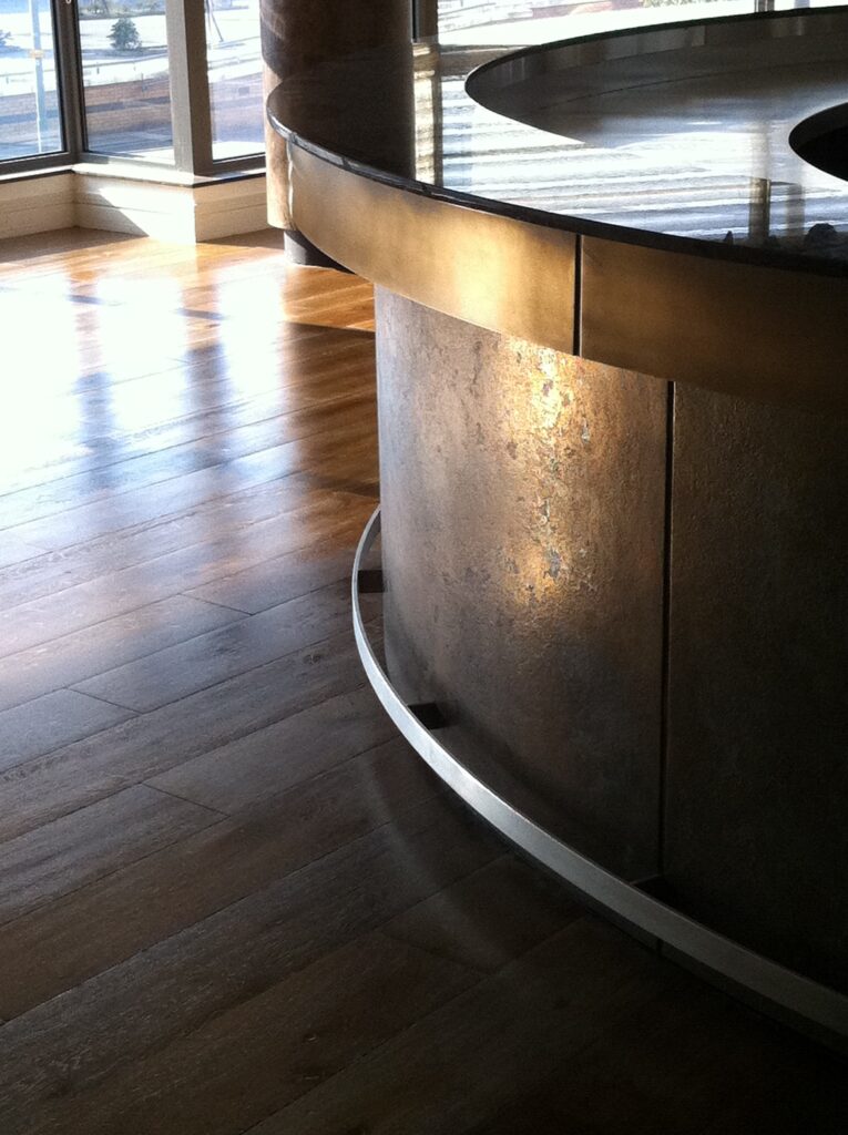 Metalier liquid metal bronze bar front with a custom aged patina in a contemporary hospitality setting – Dubai