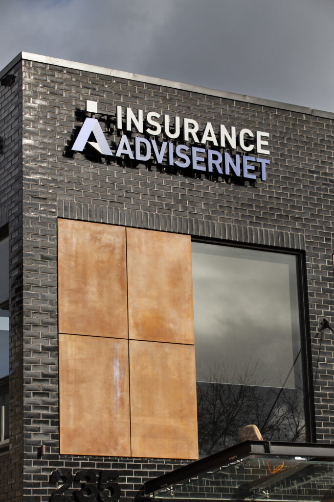 Street-level view of a modern commercial building exterior featuring architectural panels clad in Metalier liquid metal copper — New Zealand.