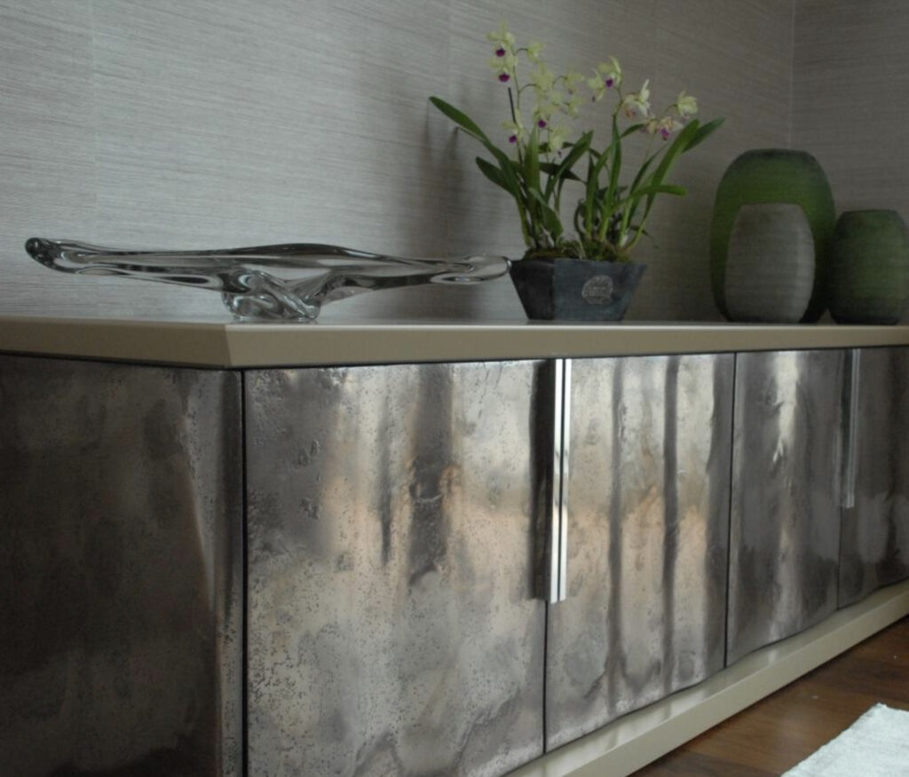Metalier liquid metal polished and textured gunmetal bronze credenza doors in a luxury residential setting – India.