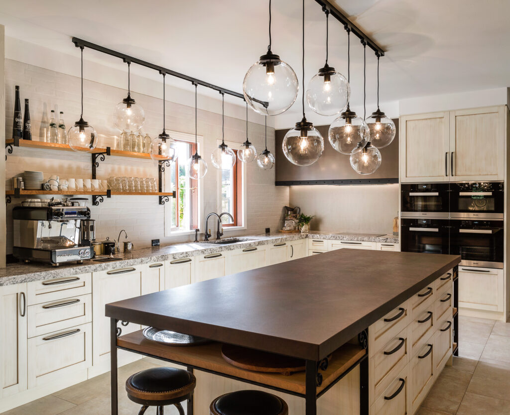Metalier liquid metal smoky bronze finish on a custom range hood and large kitchen island in a contemporary home – New Zealand.