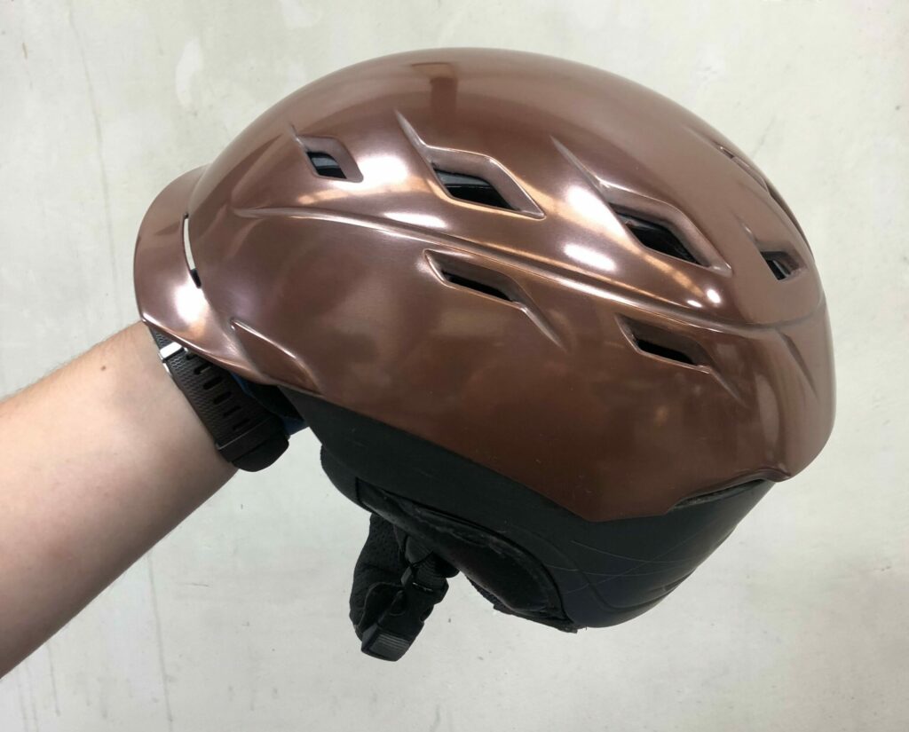 Side view of ski helmet with decorative real copper Liquid Metal Finish