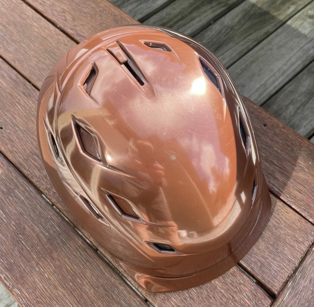 Copper-finished ski helmet showing the reflective character of real metal.